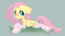 Size: 1280x719 | Tagged: safe, artist:melodylibris, character:fluttershy, species:pegasus, species:pony, g4, blushing, clothing, cute, female, floppy ears, folded wings, grass, green background, lying down, mare, prone, shyabetes, simple background, socks, solo, sploot, striped socks, wings